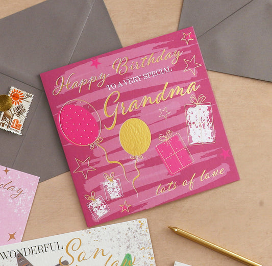 Birthday card for a special grandma with balloons and presents on a textured surface.