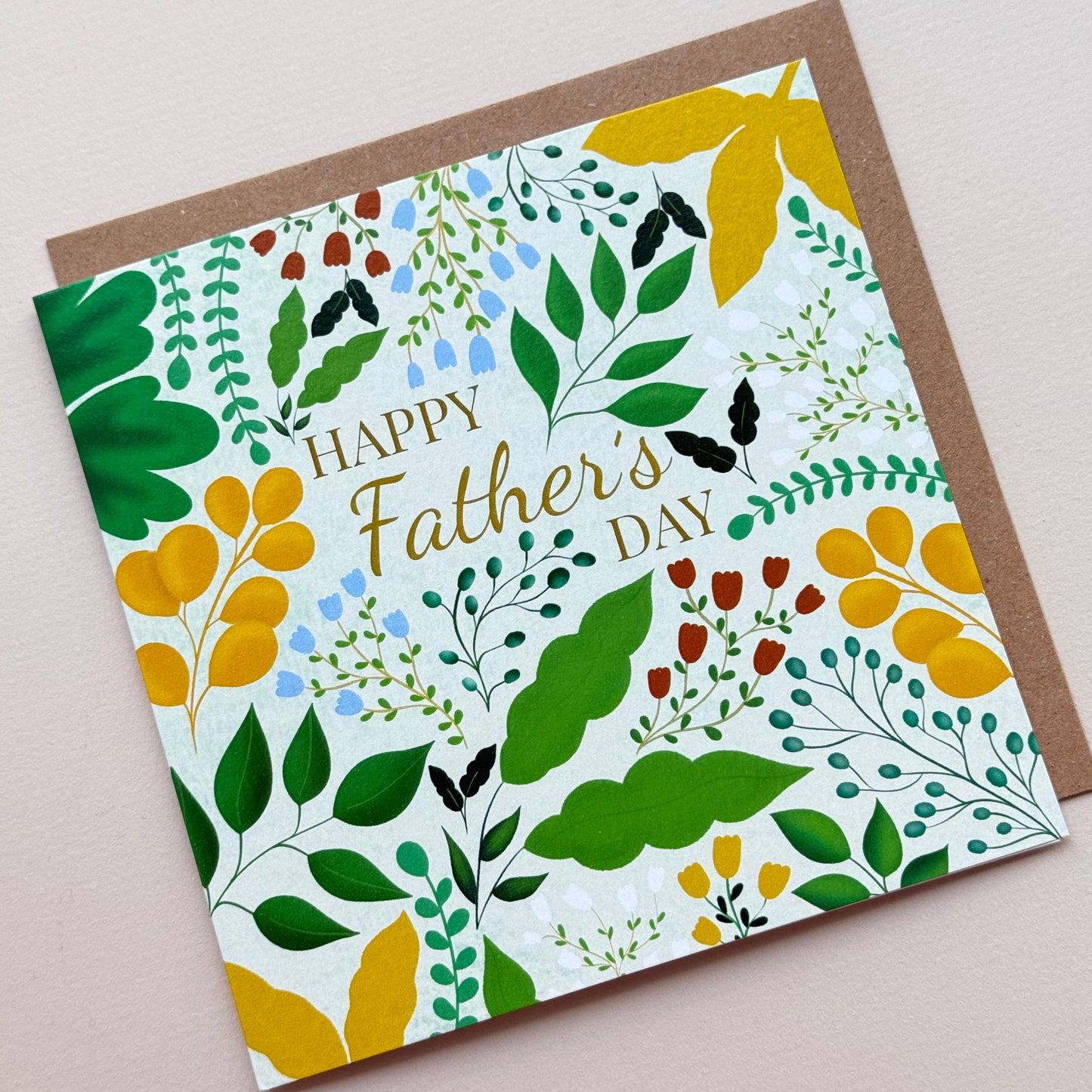 Greeting card with floral design and 'Happy Father's Day' text on a plain background.