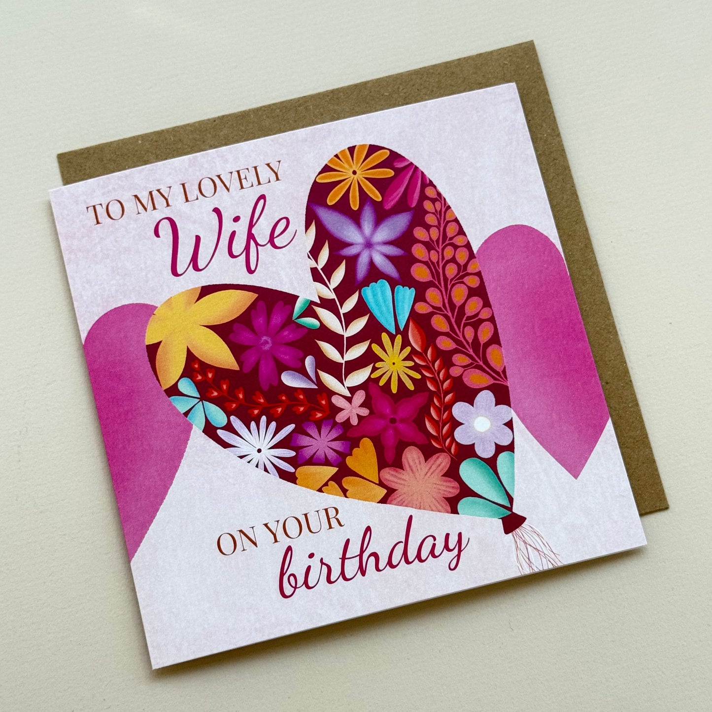 Greeting card with floral design and text on a plain background