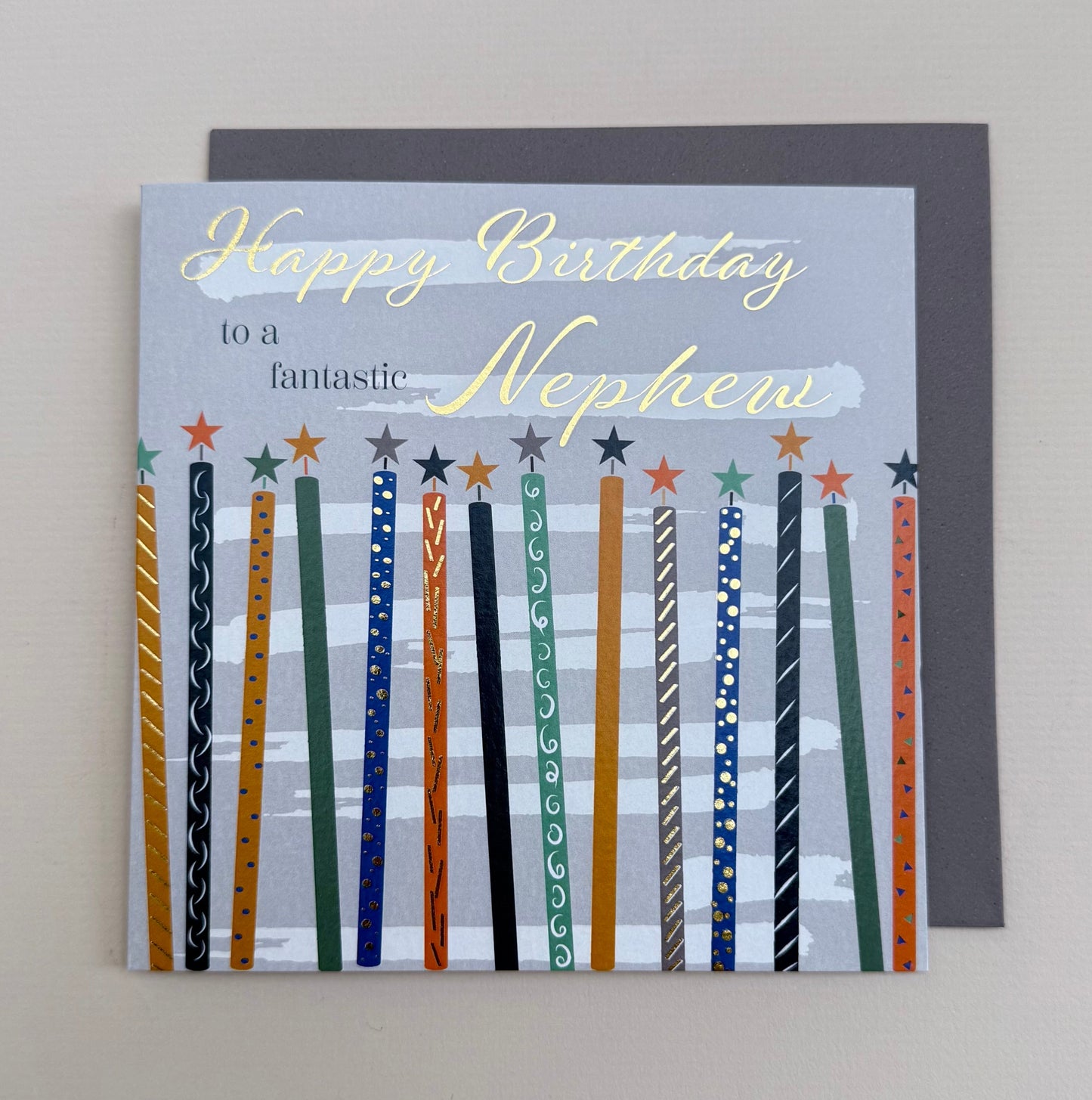 Birthday card for a nephew with colorful stripes on a gray background