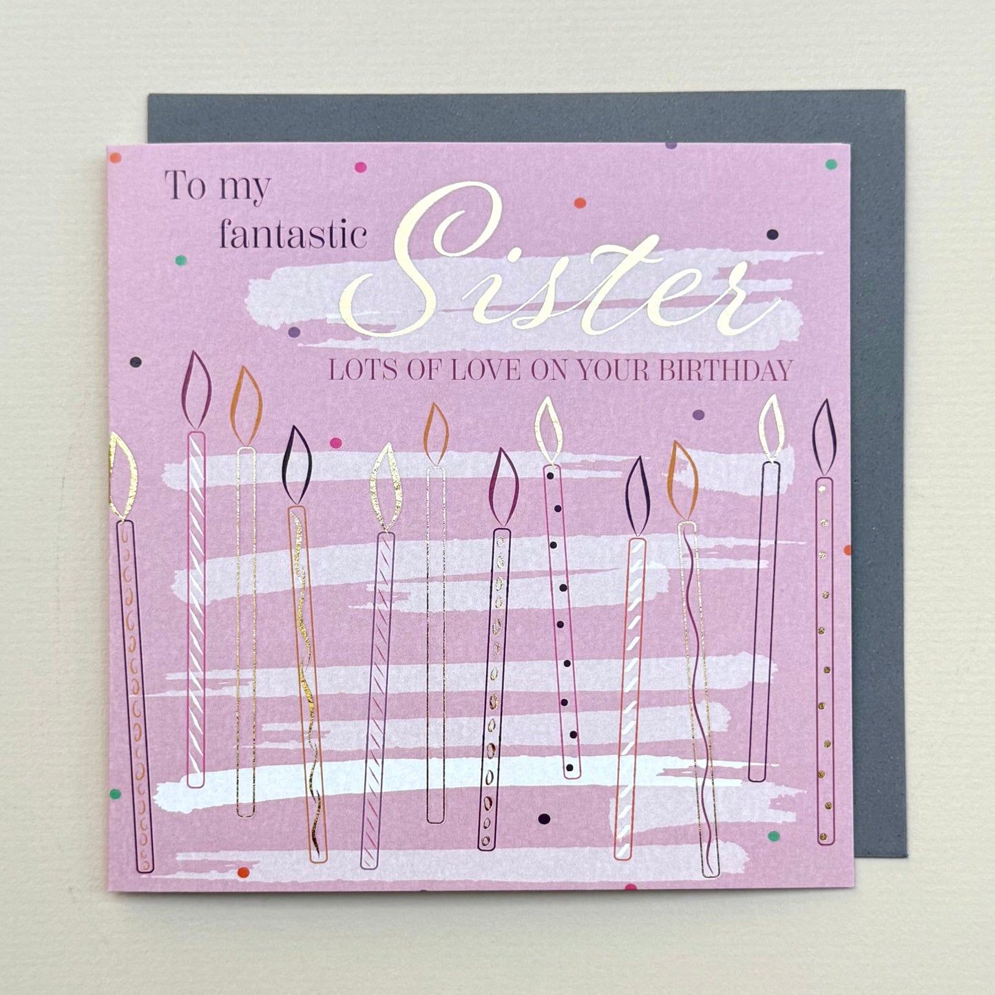 Birthday card for a sister with candles and text on a light gray background