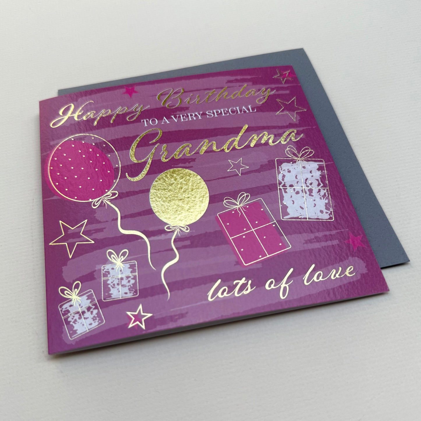 Birthday card for a special grandma with balloons and presents on a purple background