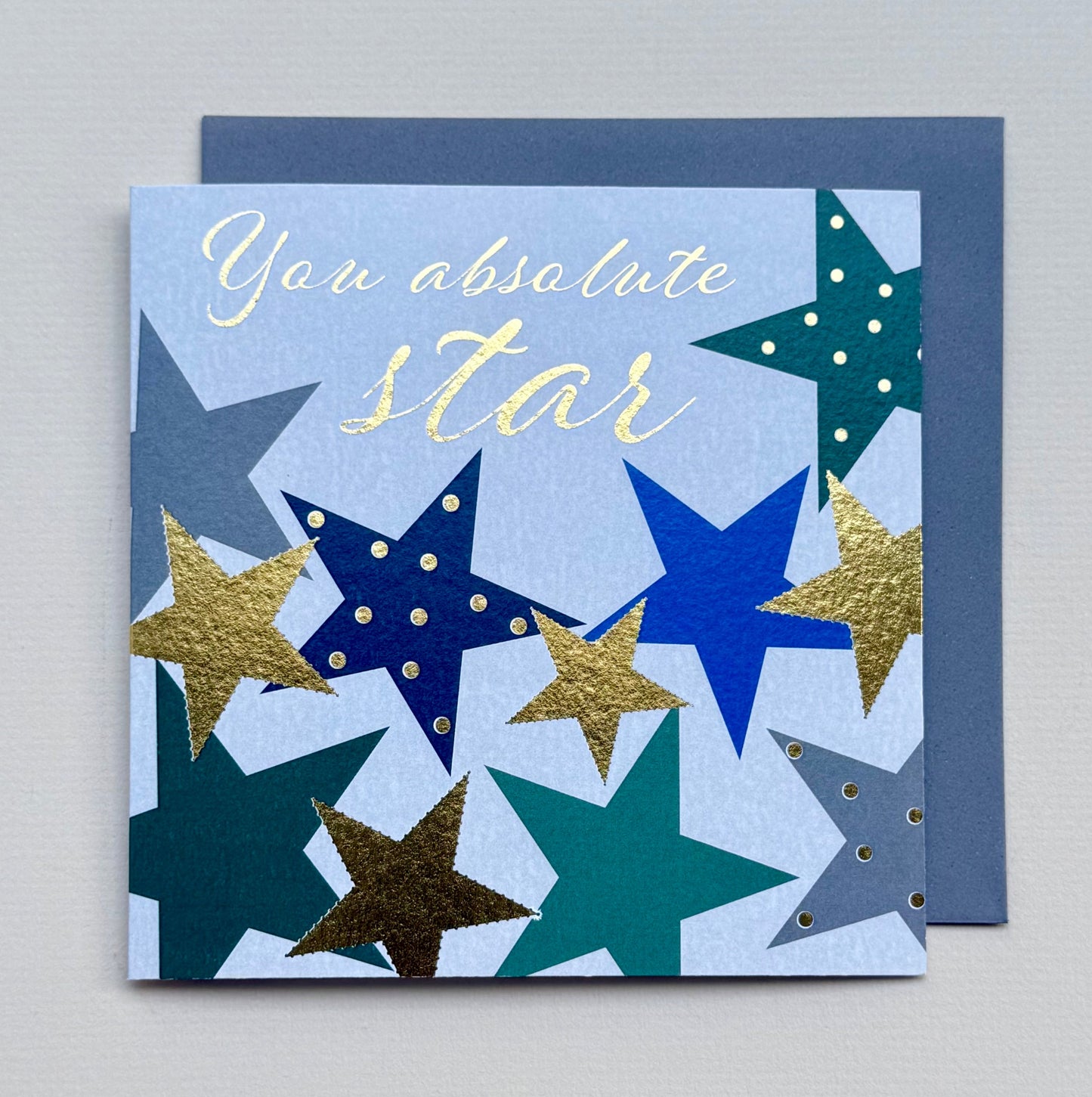 Card with star design and text 'You absolute star' on a gray background