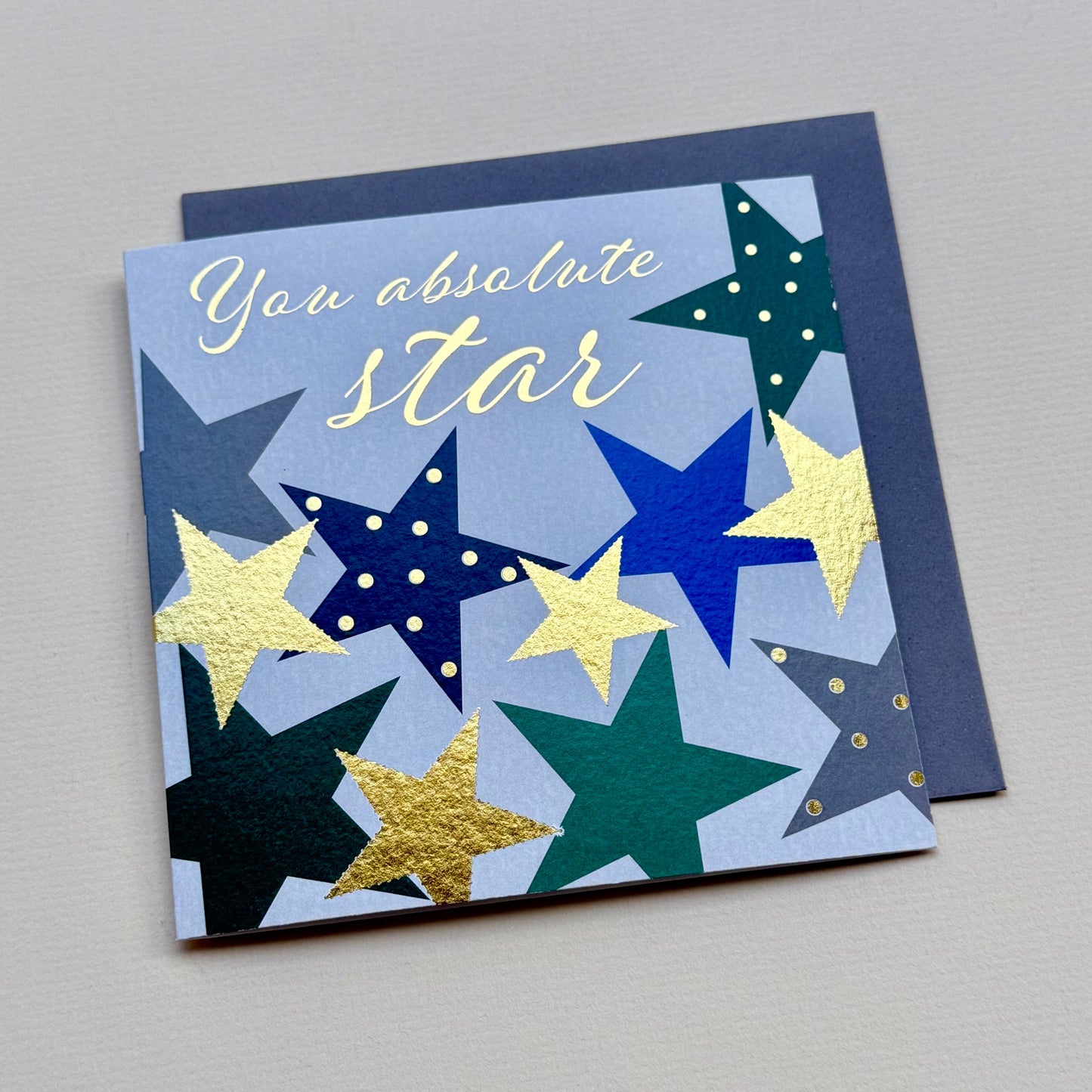 Card with colorful stars and 'You absolute star' text on a gray background