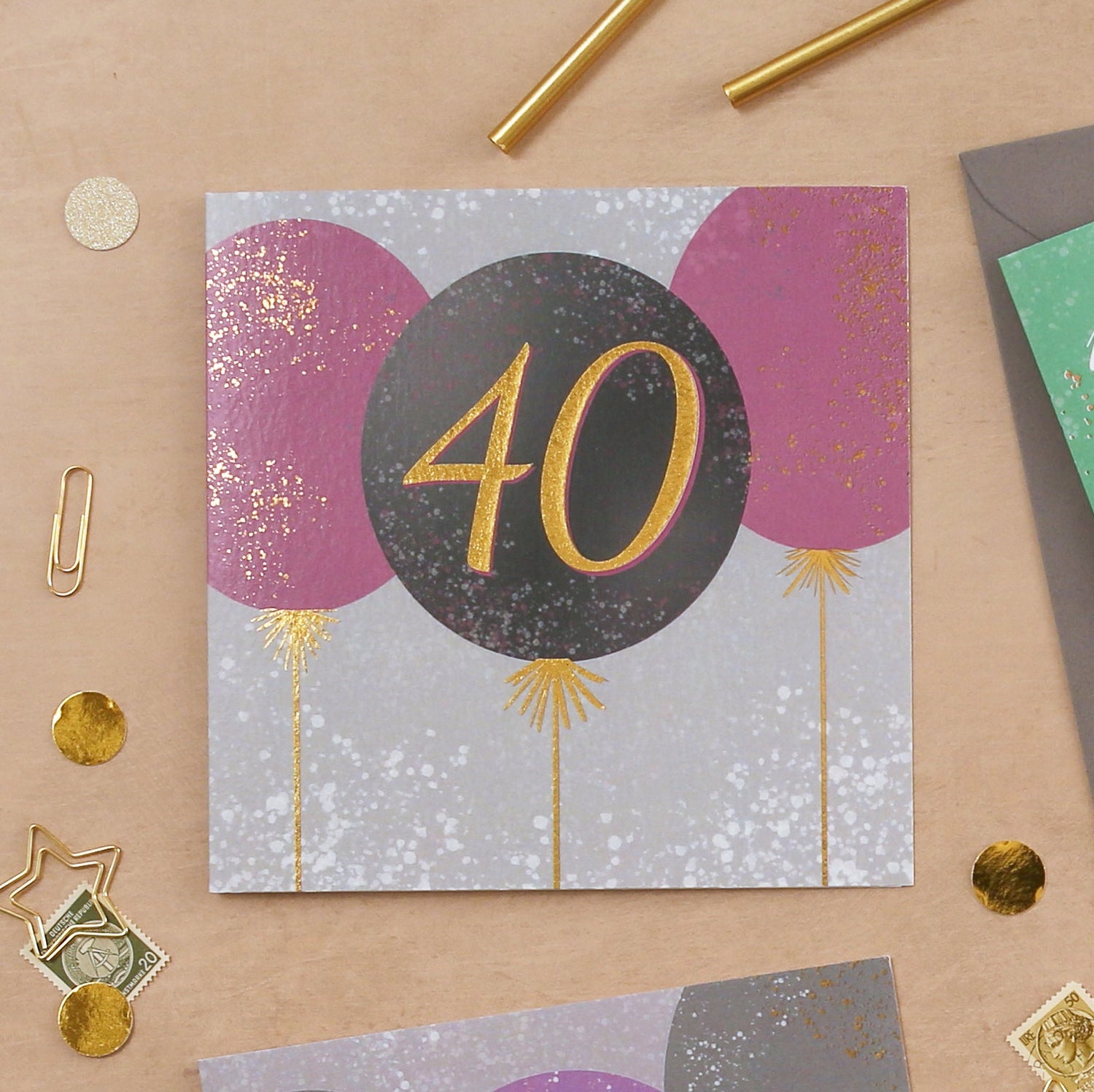 40th birthday card with balloons on a beige surface