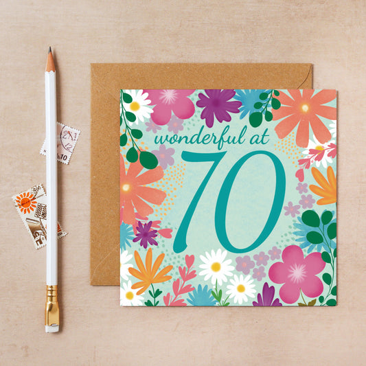 Floral birthday card with 'wonderful at 70' text on a beige background
