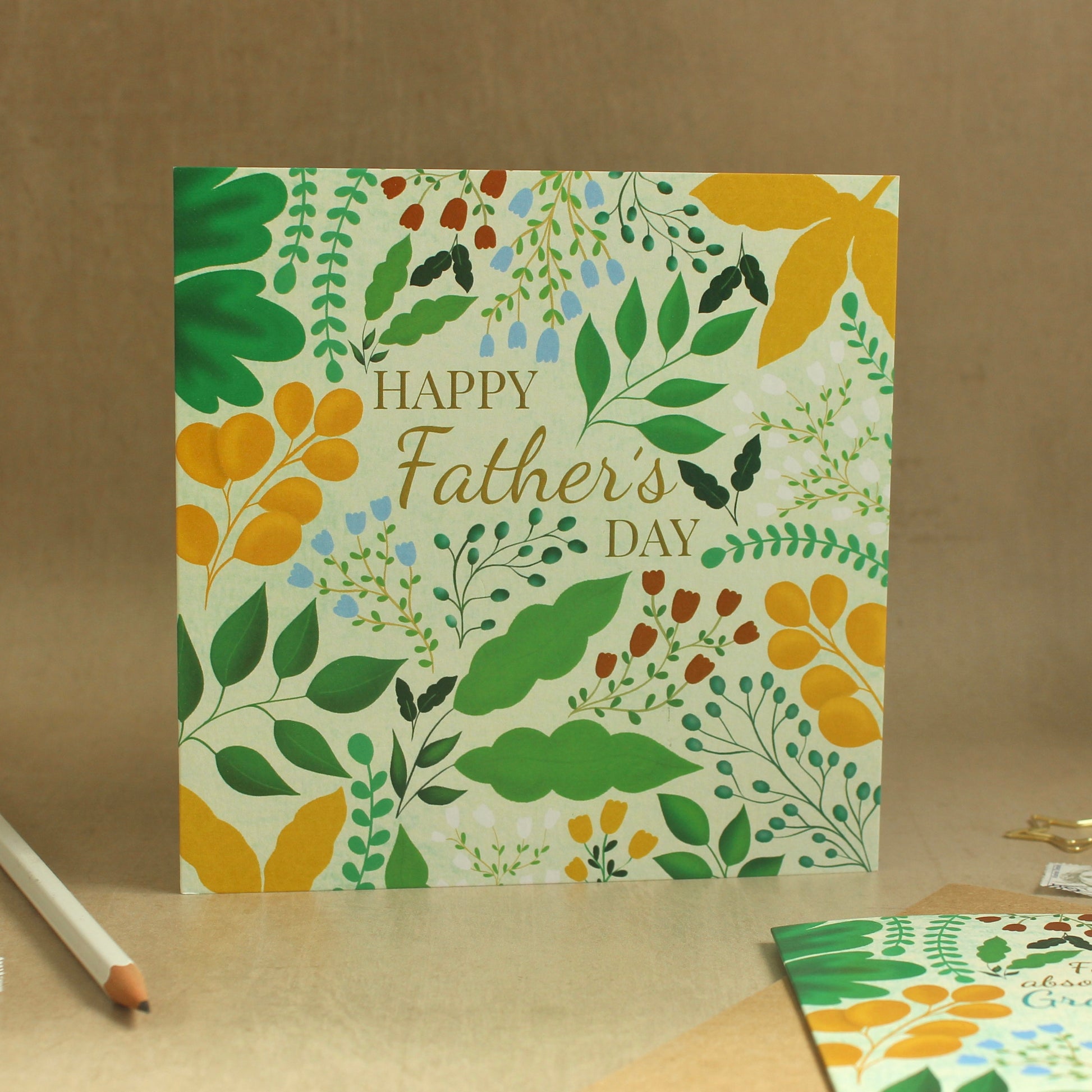 Father's Day card with floral design on a brown background