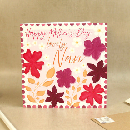 Greeting card with floral design and 'Happy Mother's Day lovely Nan' text on a beige background
