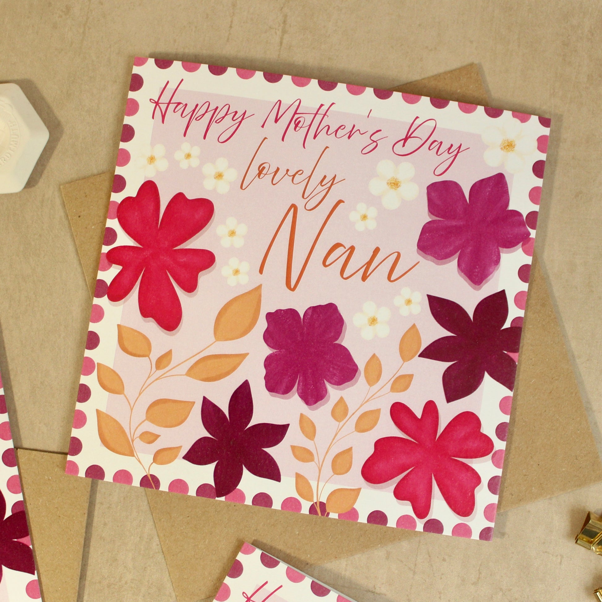 Greeting card with floral design and 'Happy Mother's Day lovely Nan' text on a beige background.