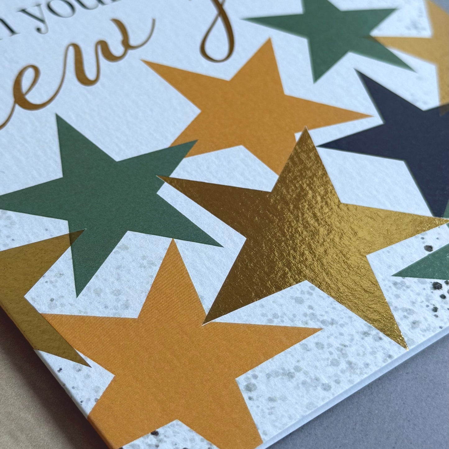 Greeting card with stars and text on a neutral background