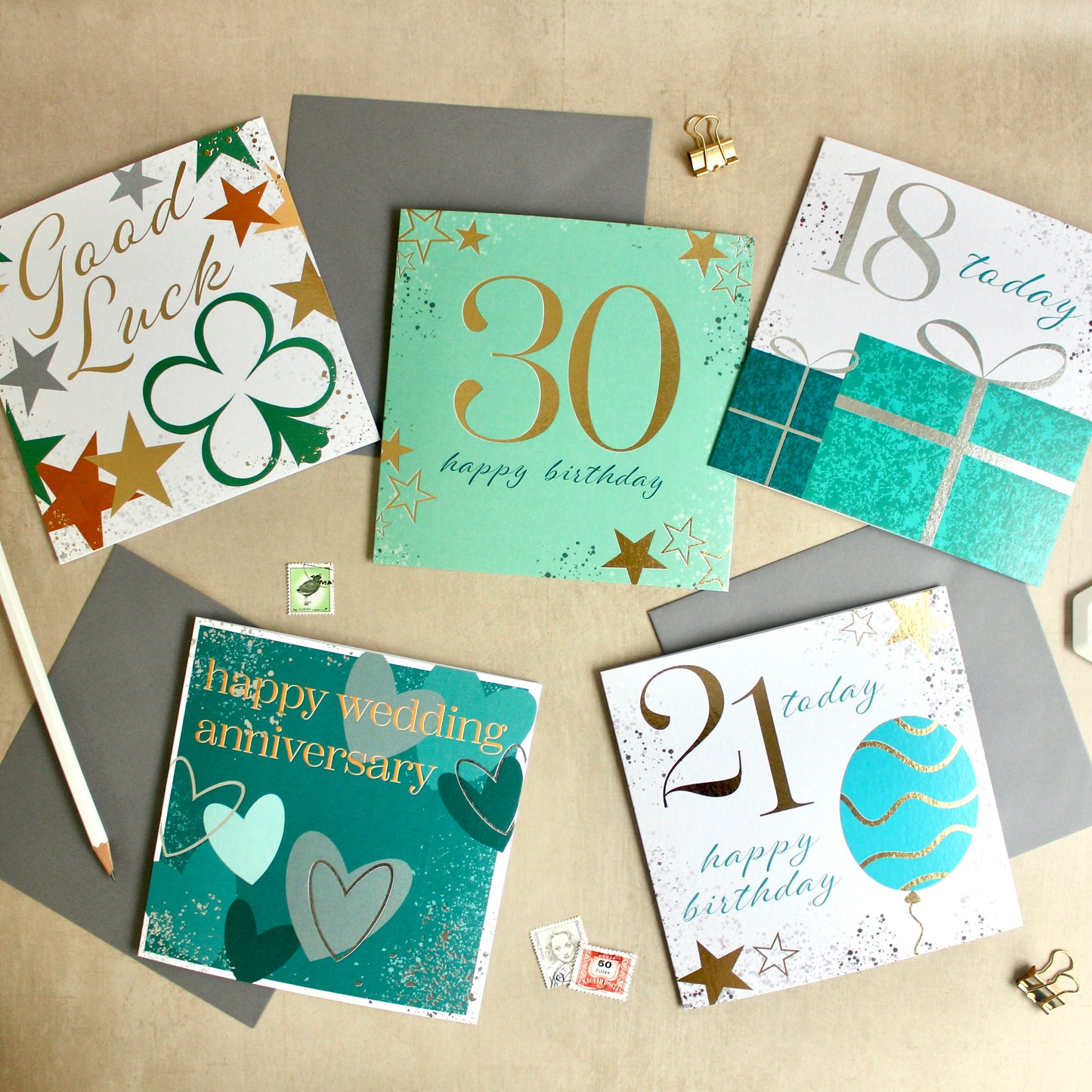 Collection of birthday and anniversary cards on a textured surface