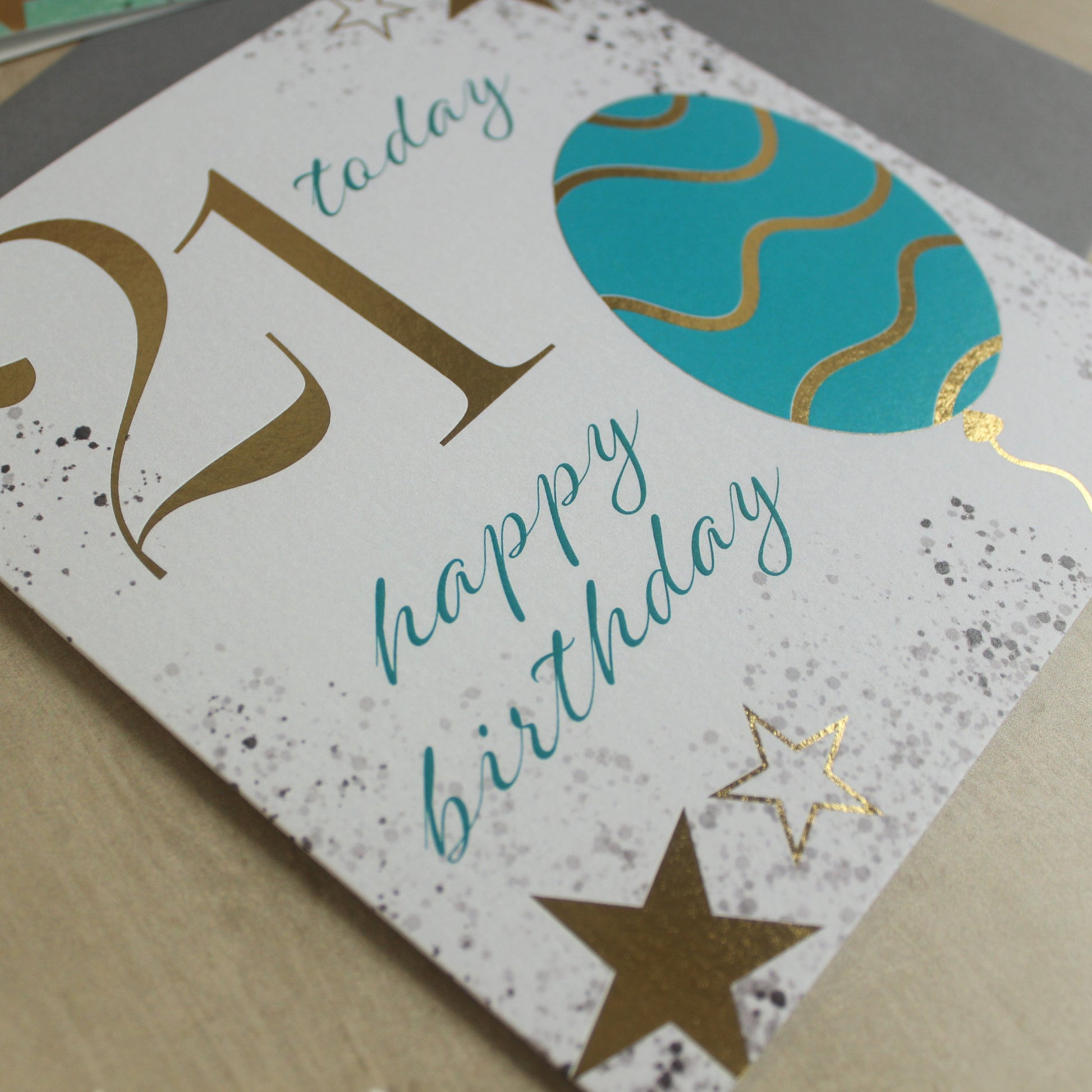 Birthday card with '21 today happy birthday' text on a textured surface