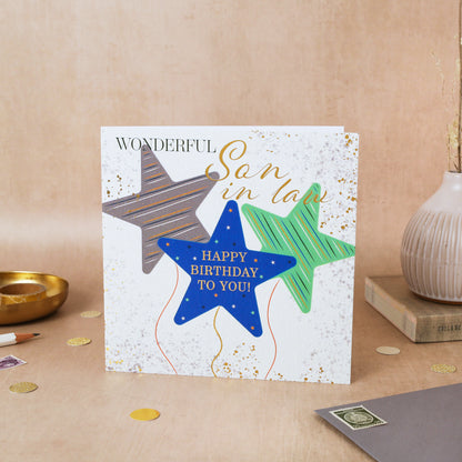 Birthday card for a son-in-law with colorful stars on a beige surface