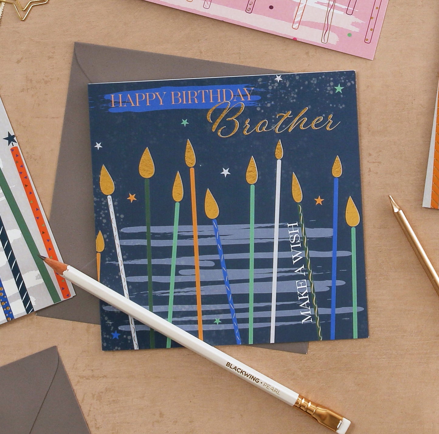 Birthday card for brother with candles on a wooden surface