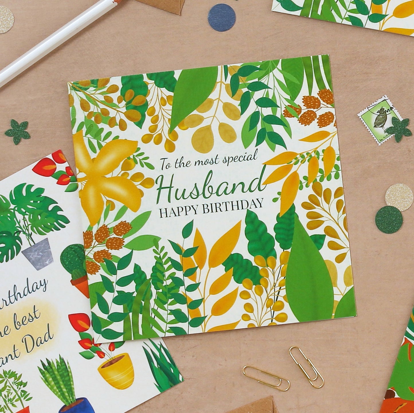 Birthday card for a husband with floral design on a wooden surface