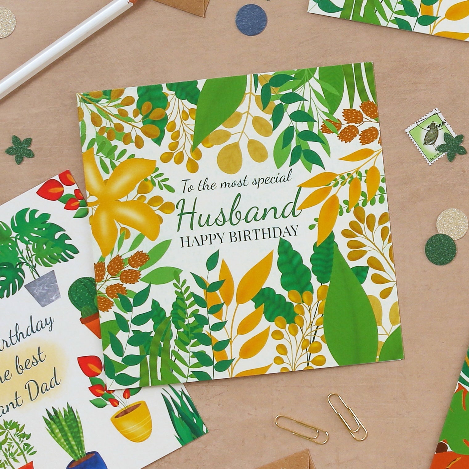 Birthday card for a husband with floral design on a wooden surface